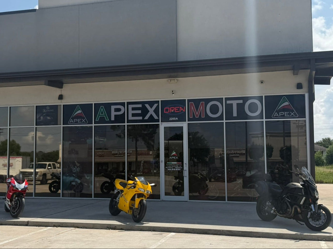 Apex Moto store front with motorcycles in front
